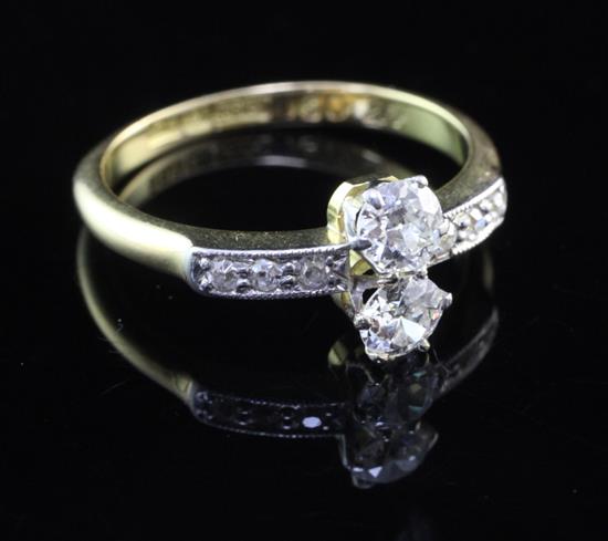 An 18ct gold and two stone diamond ring, size K.